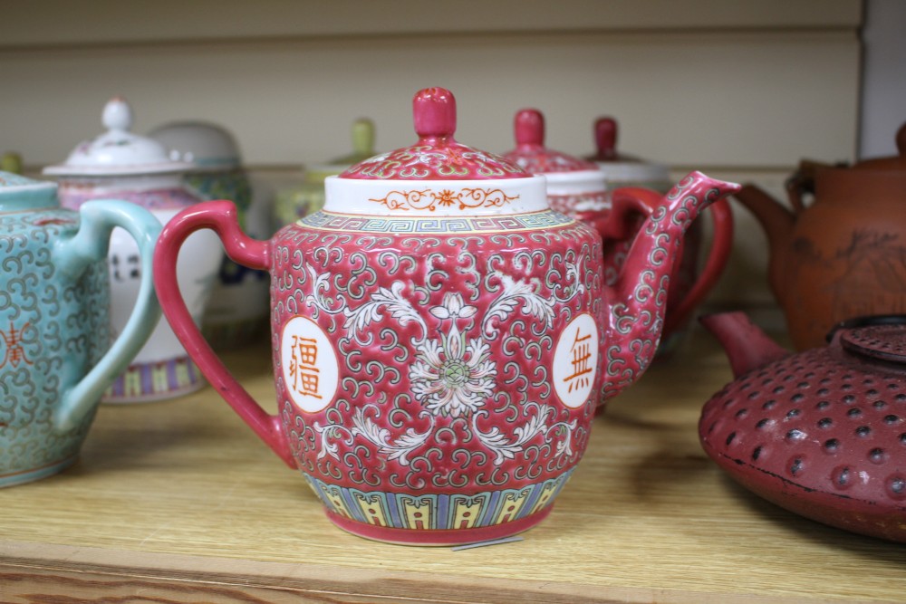 Three Chinese blue and white prunus pattern ginger jars, two other jars and ten assorted teapots